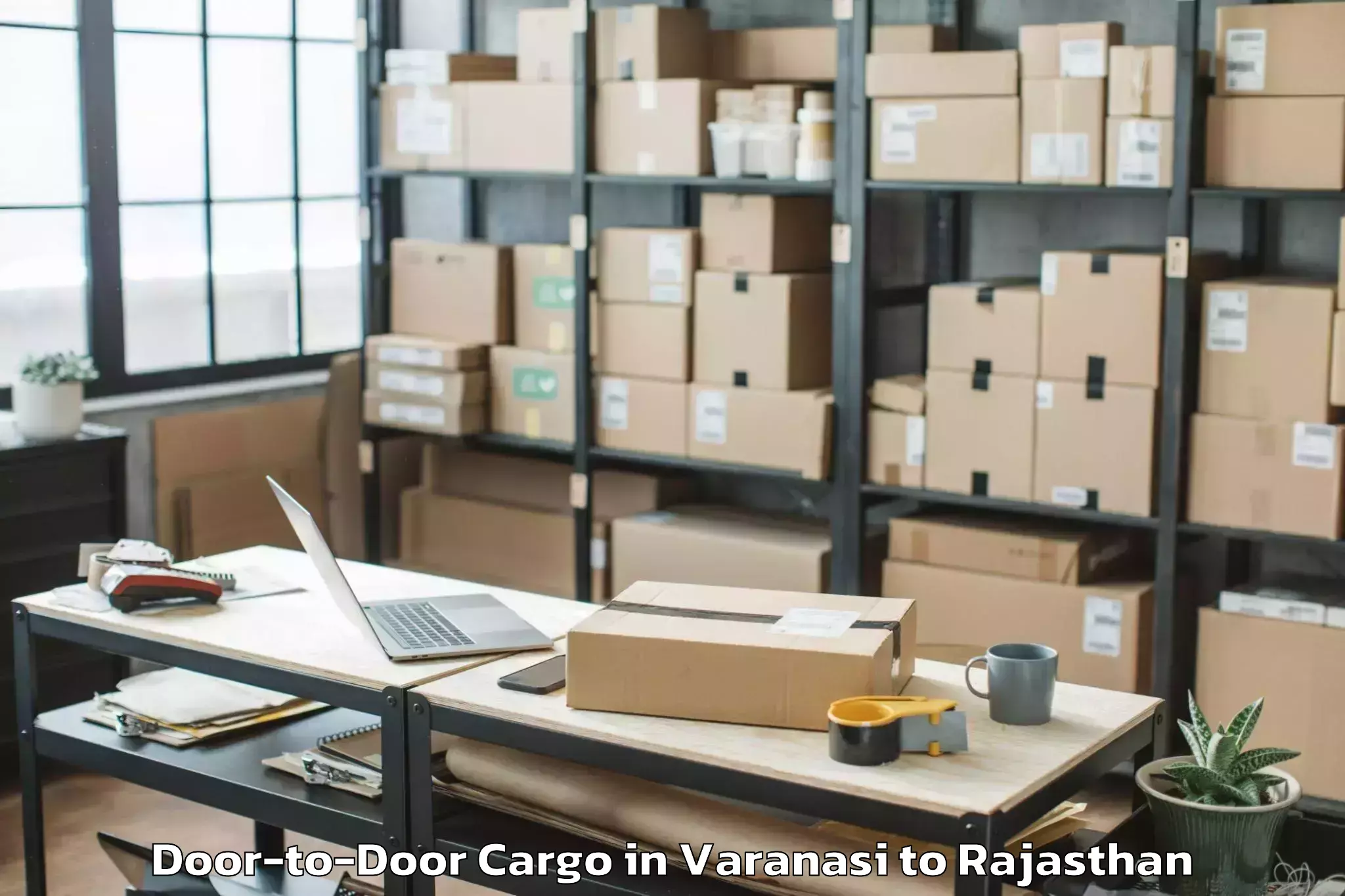 Varanasi to Tonk Door To Door Cargo Booking